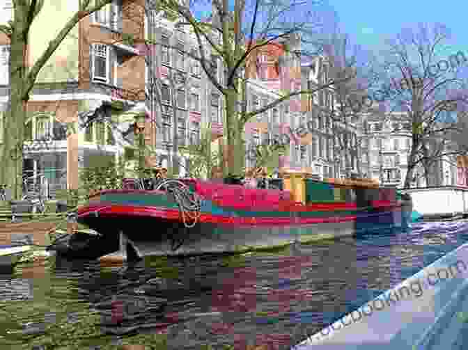 Cyclist Riding Along A Picturesque Canal Flanked By Charming Houses And Colorful Boats Walking London S Waterways: Great Routes For Walking Running And Cycling Along Docks Rivers And Canals